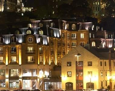 A view of Quebec City at night, displaying its old world charm with a new trendy flair.