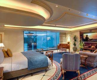 A large bedroom with a large bed and a flat screen tv offers the perfect blend of luxury and comfort.