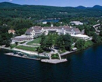 An aerial view of The Sagamore Resort, a large mansion on a lake in Bolton Landing, NY.