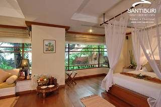 A heavenly bedroom with a canopy bed.