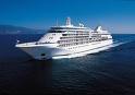 A large white cruise ship sailing in the ocean on Silversea Cruises.