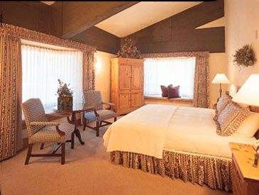 A bed or beds in a room at Stein Eriksen Lodge, where snow and ski activities come together.