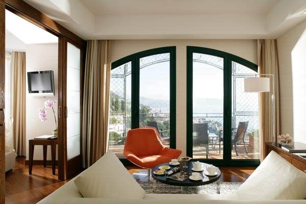 A romantic living room with a view of the ocean.