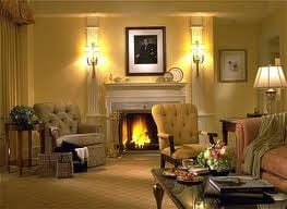 Yellow walls and a fireplace in the Presidential Suite at the Taj Boston offer ultimate luxury.