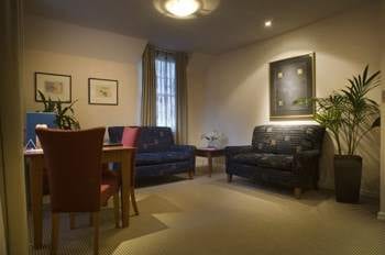A living room with a table and chairs designed to explore the blissful privacy.