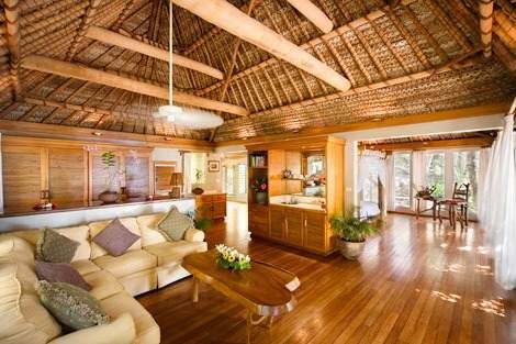 A living room with wooden floors.