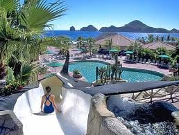 A woman enjoying her own sanctuary on a water slide at Villa del Palmar.