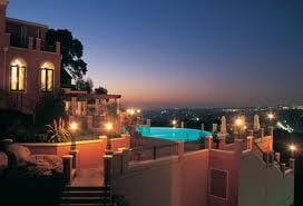 A house with a pool at night, showcasing nature at its best.