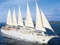 A large white ship sailing around the world.