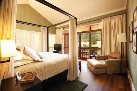 A bedroom with sliding glass doors in the Blue Mountains.