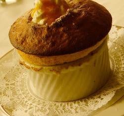 A dessert is sitting on a plate with whipped cream, in one of the girlfriend getaway eateries during the holidays in NYC.