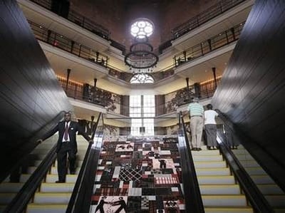 A man walks up the stairs of The Liberty Hotel in Boston, Massachusetts.