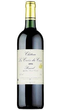 A bottle of Petrus red wine on a white background.