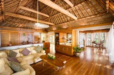 A living room with wooden floors.