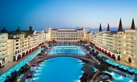 Enjoy your stay at Mardan Palace with a stunning swimming pool at dusk.