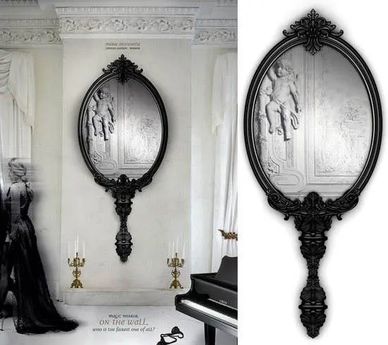 An ornate Marie Antoinette mirror resembling the mirror used in the Palace of Versailles sits in a room with a piano.