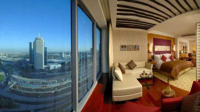 A hotel room with a view of the city at The Monarch, where you can Be the Monarch from the top floor.