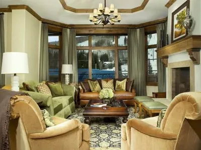 Arrabelle Private Residences at Vail Square featuring a living room with a fireplace and couches.