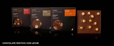 Four chocolate bars with nuts on them at Vioko in Barcelona - the Best Chocolate & Gelato.