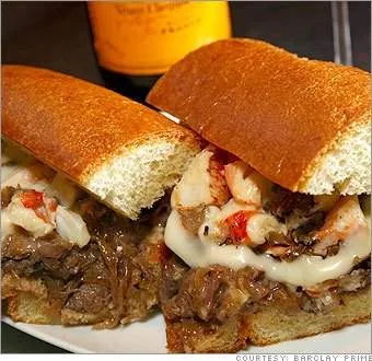 Enjoy two sandwiches on a plate next to a bottle of wine at Barclay Prime in Philadelphia.