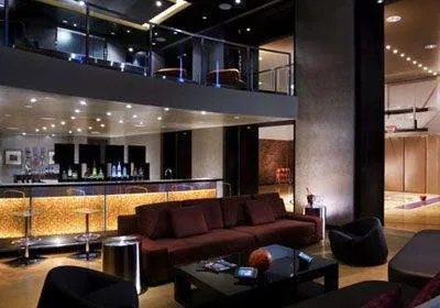 A large living room with couches and a bar located in Steve Wynn Casino, Las Vegas.