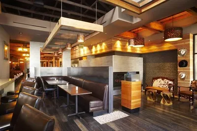 The interior of a restaurant with wooden floors and walls, perfect to enjoy American style cuisine at Cowboy Star.