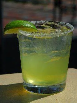 A lime margarita at Johnny Utah's with a lime wedge on top.
