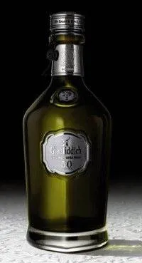 Discover the Most Precious Whisky from Glenfiddich on a table with a black background.