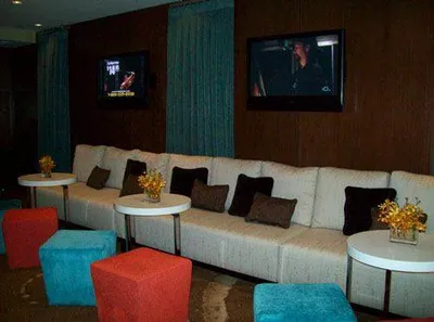 A living room with couches and coffee tables.