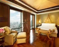 A hotel room with a large bed and a stunning view of the city, allowing you to discover Cannes in a new avatar.