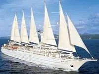 A large white ship sailing around the world.