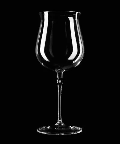 Diamond studded wine glass on black background.