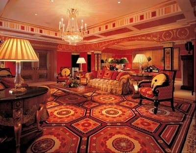 An extravagantly decorated living room with a chandelier fit for royalty.