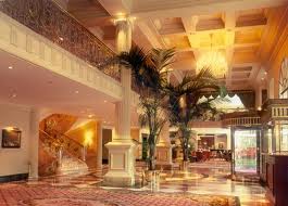 An opulent lobby with a marble floor in Viennese style.