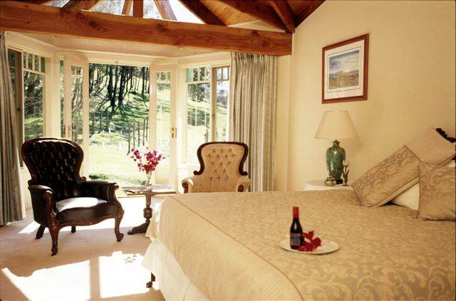A bed or beds in a room at Chateau Yering, a heritage Victorian mansion in Yarra Valley.