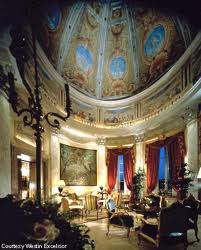 An ornate living room with a large ceiling in the Villa La Cupola Suite at The Westin Excelsior, Rome comes alive with great Roman frescoes.